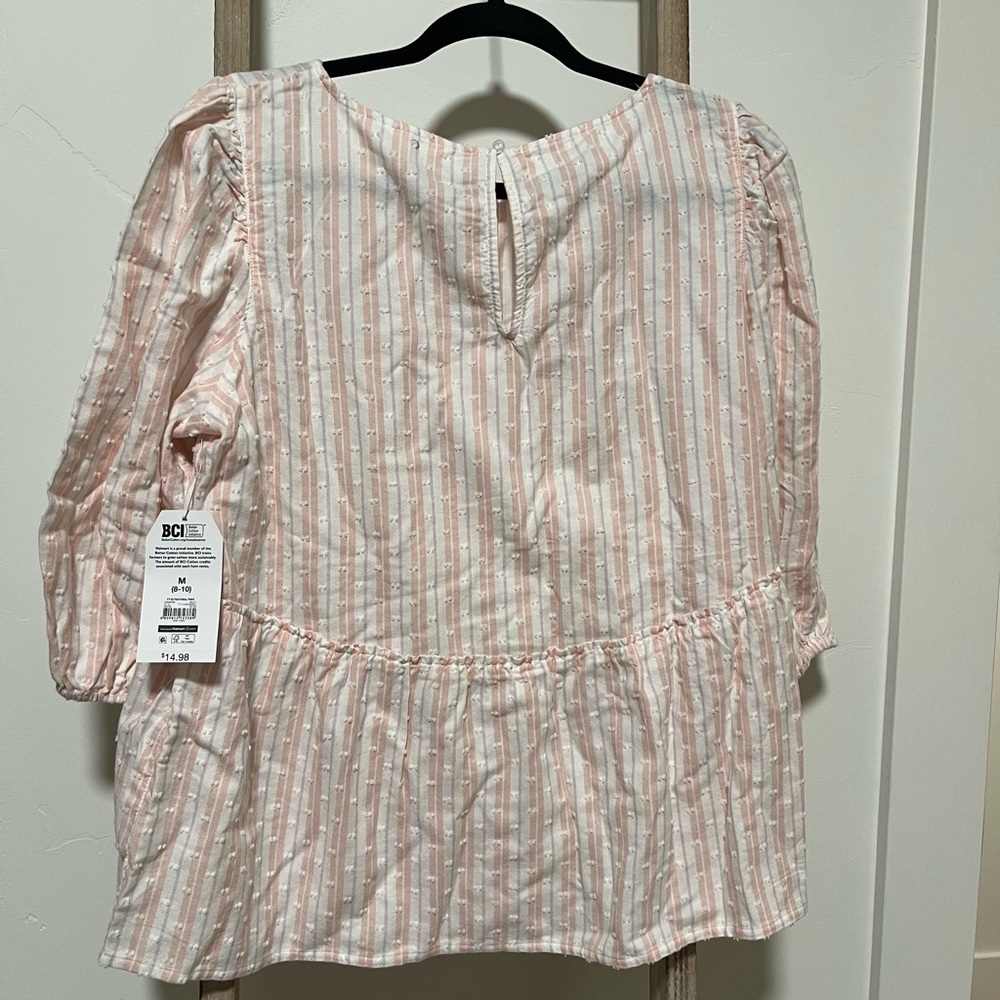 Women’s vertical striped shirt. Secures in the back with loop and button.